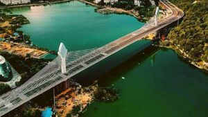 Night view of Durgam Cheruvu cable-stayed bridge in Hyderabad illuminated with colorful LED lights”(For daytime images)
“Durgam Cheruvu Bridge in Hyderabad showcasing modern cable-stayed architecture during daytime”