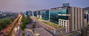 Exterior view of Mindspace IT Park in Hyderabad featuring modern office buildings and landscaped surroundings”(For skyline or evening images)
“Mindspace IT Park in Madhapur, Hyderabad with illuminated office buildings during evening hours”