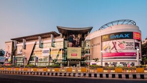 “Interior view of Nexus Forum Mall Hyderabad with shoppers and retail stores”
